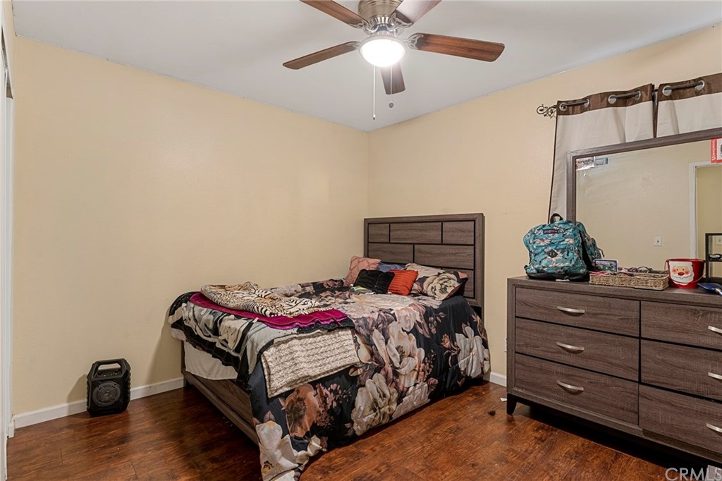 5005 Pearblossom Drive Riverside, CA 92507 - Photo 12 of 19 a bedroom with a bed and a dresser
