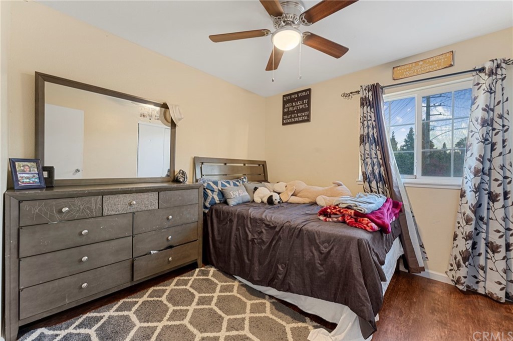 5005 Pearblossom Drive Riverside, CA 92507 - Photo 14 of 19 a bedroom with a large bed and a window