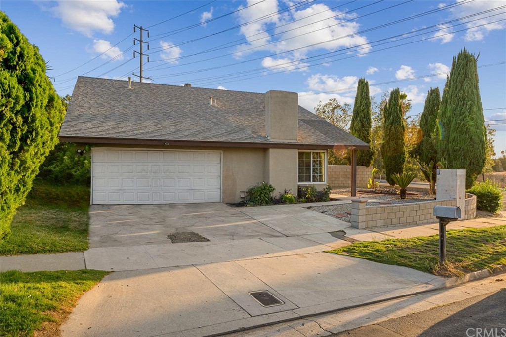 5005 Pearblossom Drive Riverside, CA 92507 - Photo 2 of 19 a front view of a house with garden