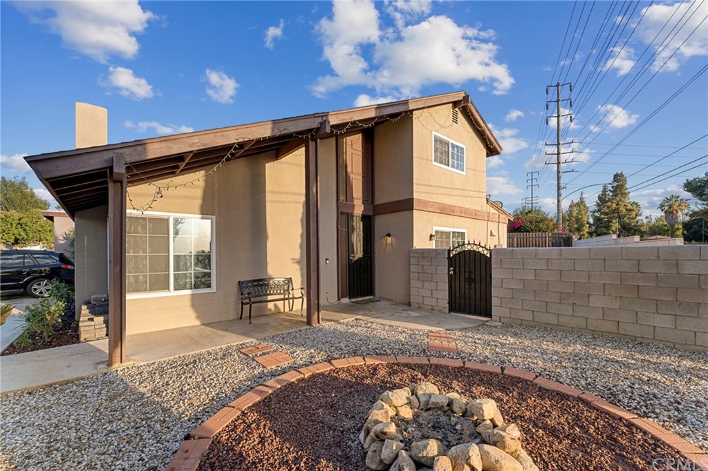 5005 Pearblossom Drive Riverside, CA 92507 - Photo 3 of 19 a front view of a house with a yard