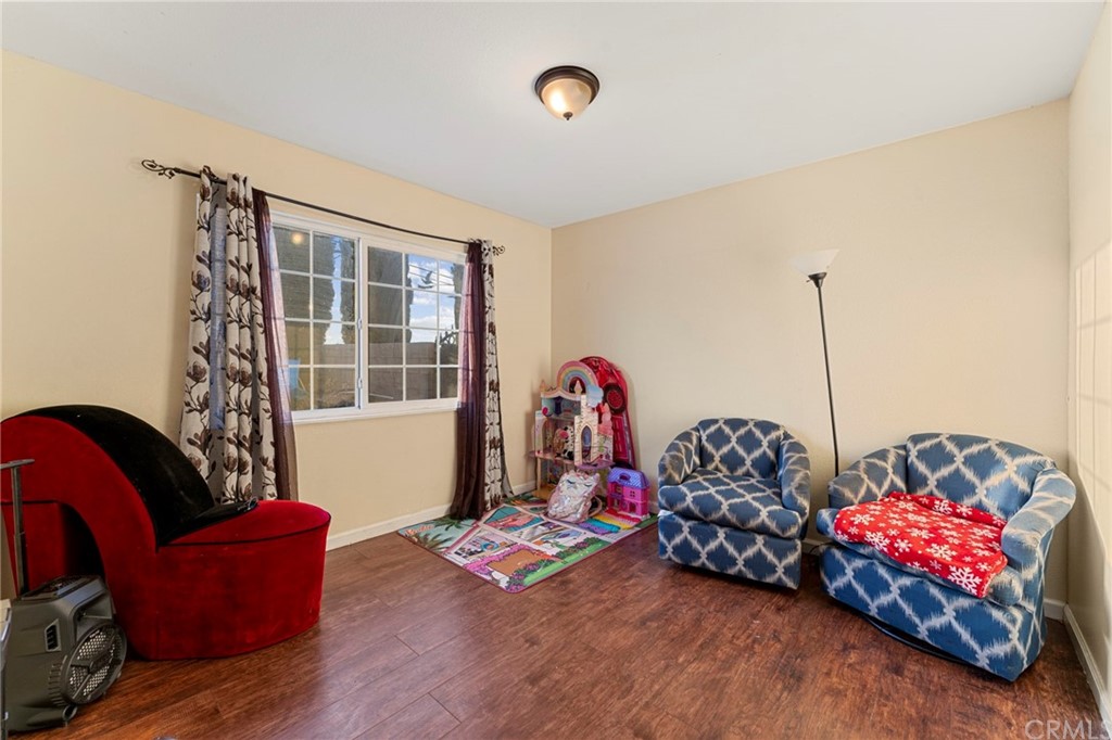 5005 Pearblossom Drive Riverside, CA 92507 - Photo 8 of 19 a bedroom with furniture and a window