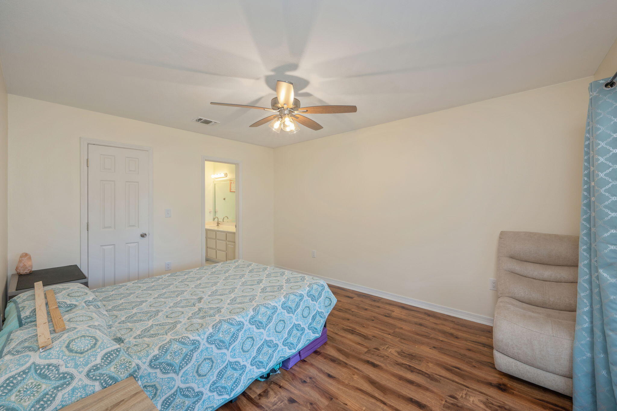 4654 Browning Court Crestview, FL 32539 - Photo 11 of 45 a bedroom with a bed and a ceiling fan