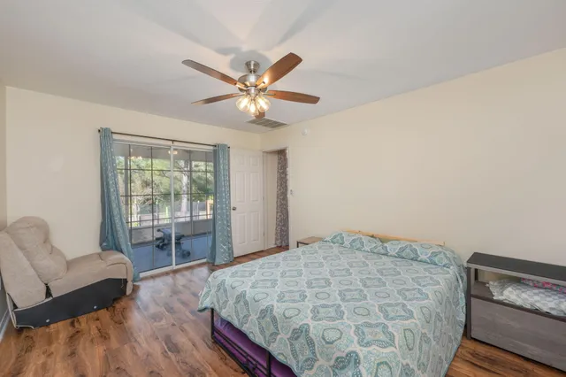 a bedroom with a bed and a couch