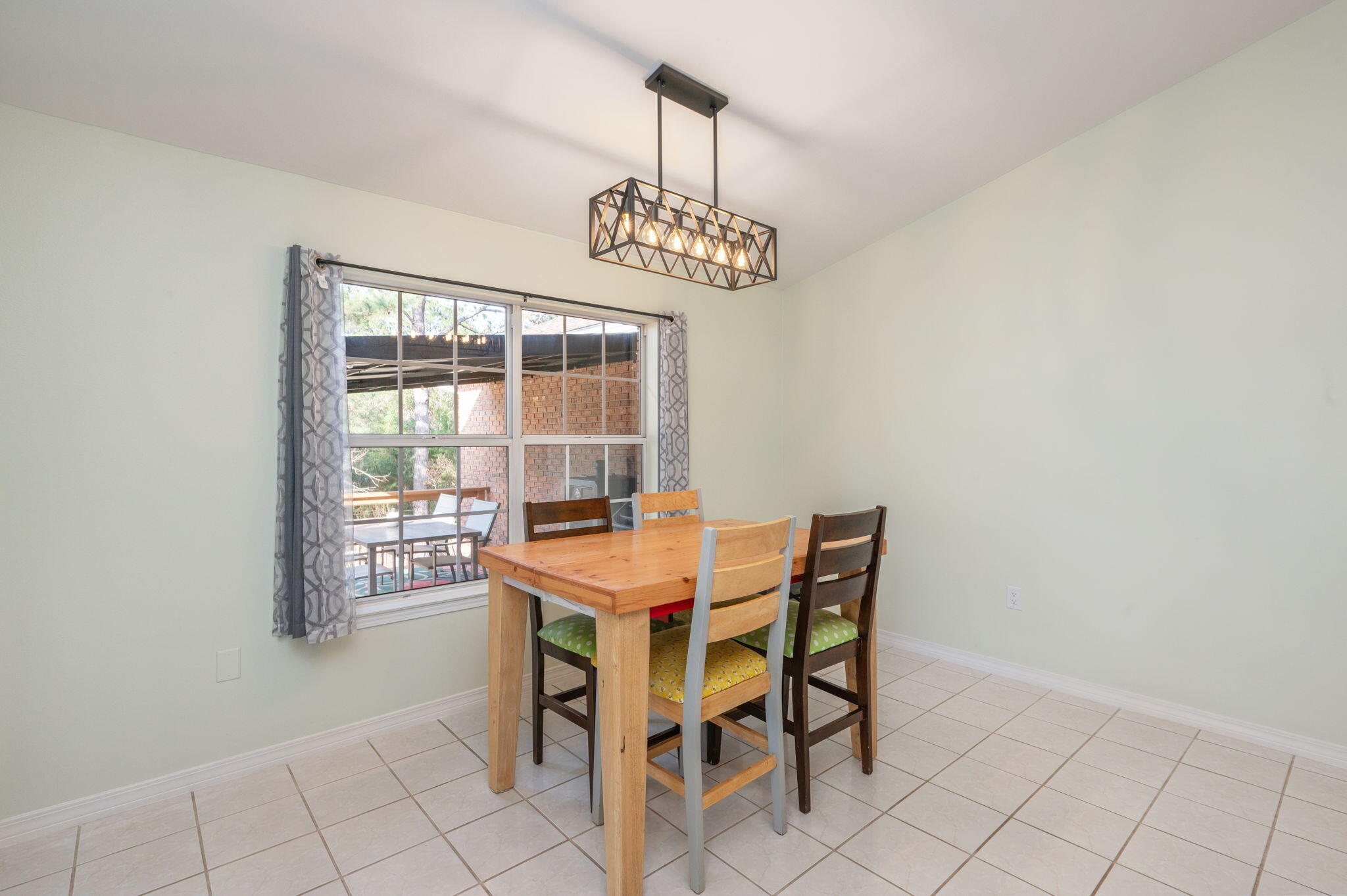 4654 Browning Court Crestview, FL 32539 - Photo 15 of 45 a view of a dining room with furniture window and outside view