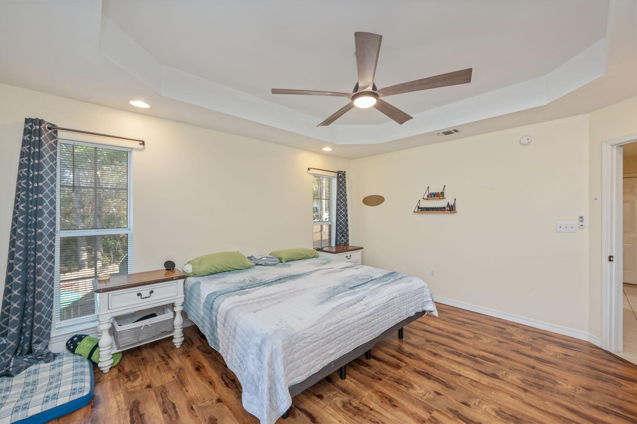 4654 Browning Court Crestview, FL 32539 - Photo 21 of 45 a bedroom with a bed and wooden floor