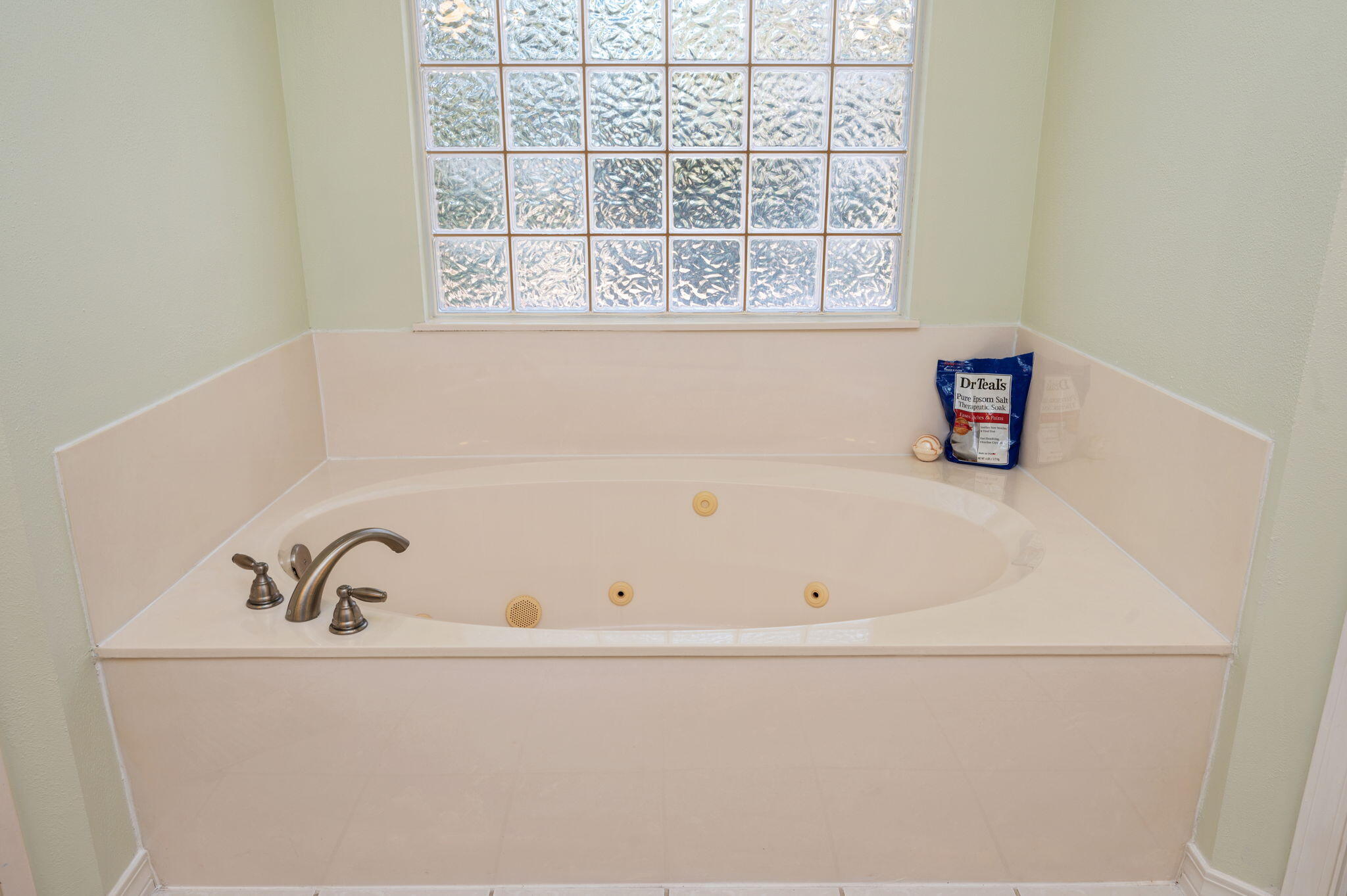 4654 Browning Court Crestview, FL 32539 - Photo 28 of 45 a white bath tub sitting next to a window