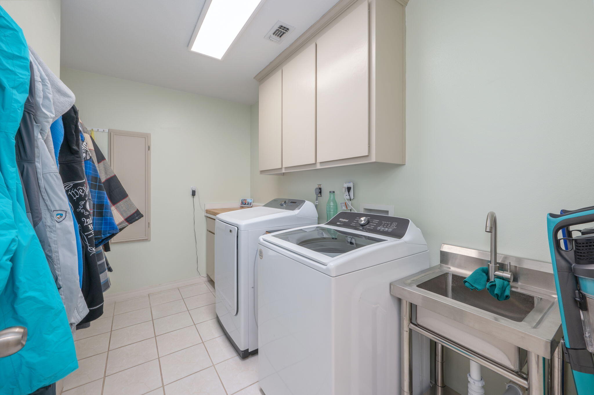 4654 Browning Court Crestview, FL 32539 - Photo 32 of 45 a utility room with cabinets washer and dryer