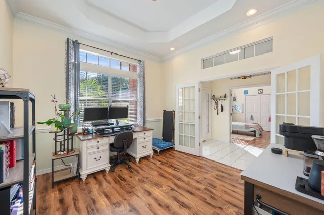 a workspace with furniture and a flat screen tv