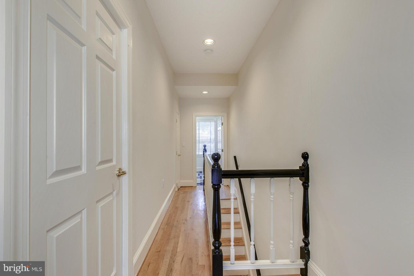 245 10th Street Northeast Washington, DC 20002 - Photo 14 of 17 a view of a hallway with wooden floor and staircase