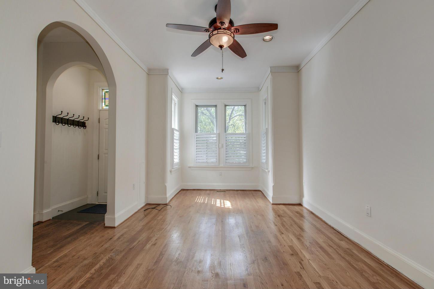 245 10th Street Northeast Washington, DC 20002 - Photo 3 of 17 a view of empty room with wooden floor and fan
