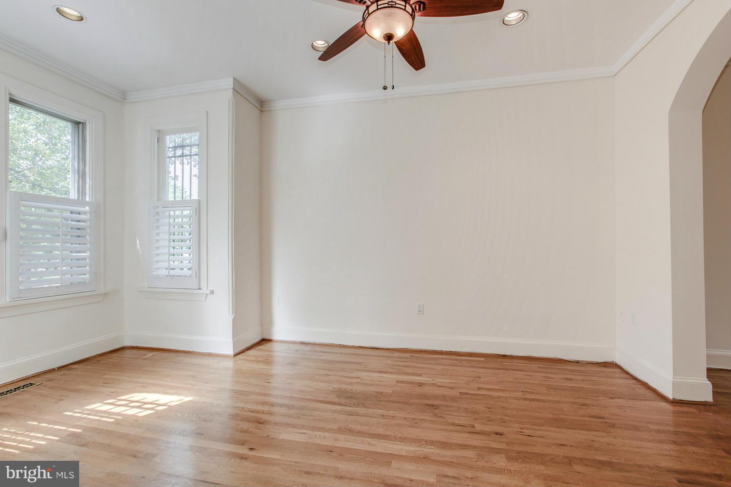 245 10th Street Northeast Washington, DC 20002 - Photo 4 of 17 wooden floor in an empty room with a window