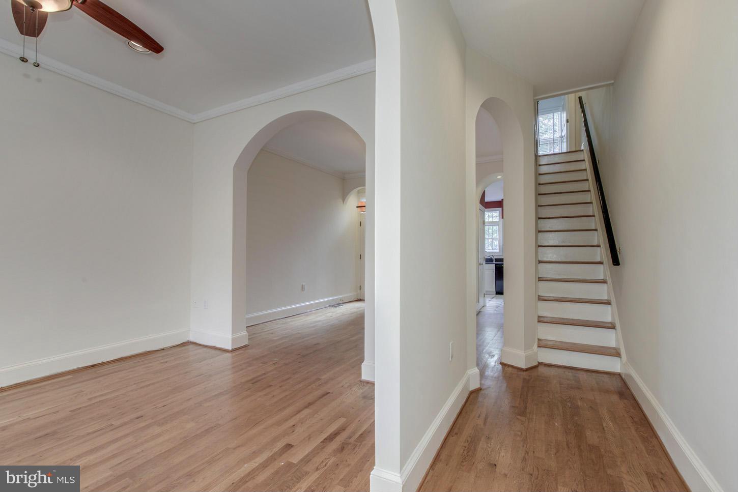 245 10th Street Northeast Washington, DC 20002 - Photo 5 of 17 wooden floor in an empty room with a window