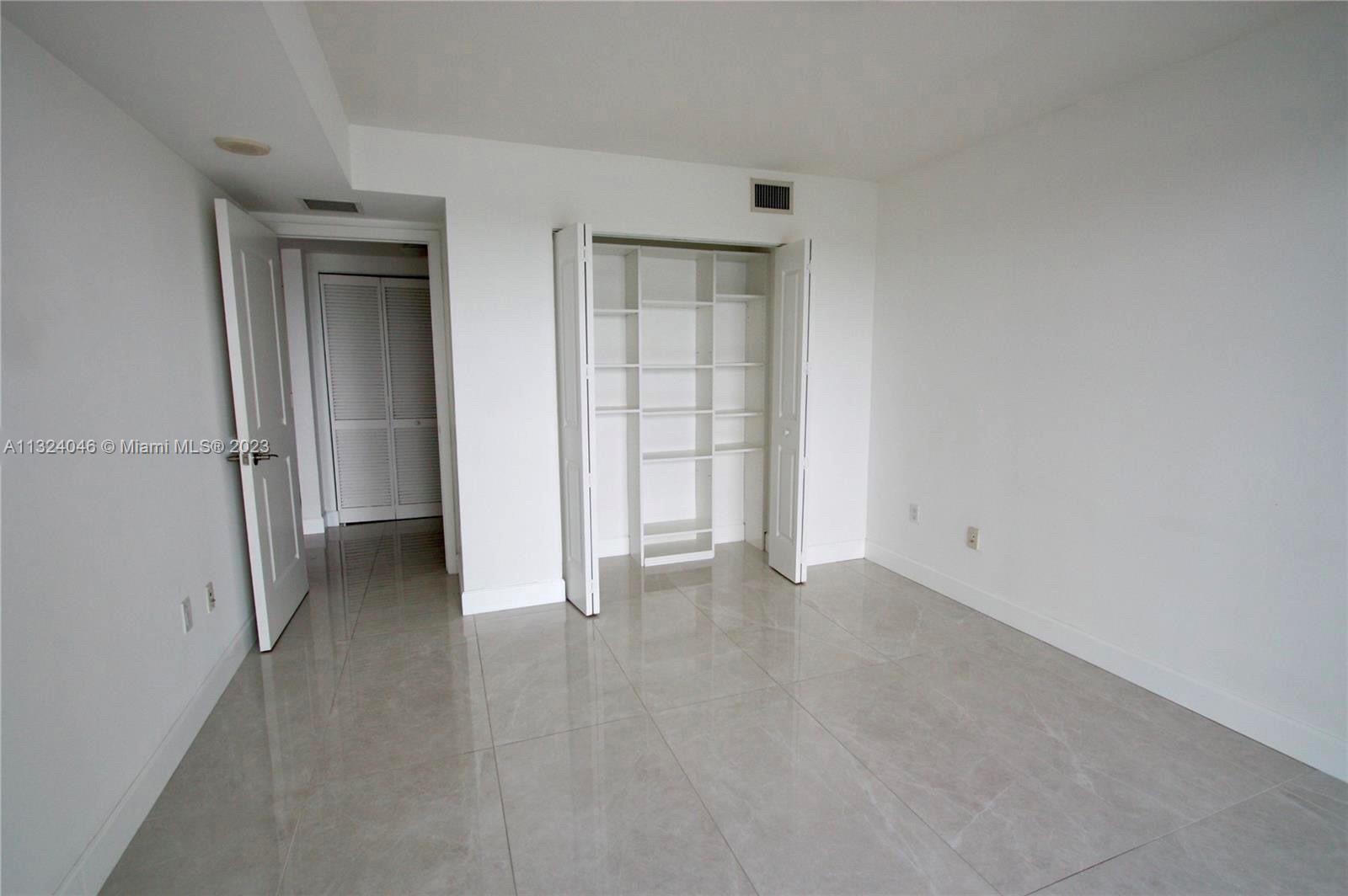 2681 North Flamingo Road, Unit 506S Sunrise, FL 33323 - Photo 12 of 20 a view of an empty room with closet and a window