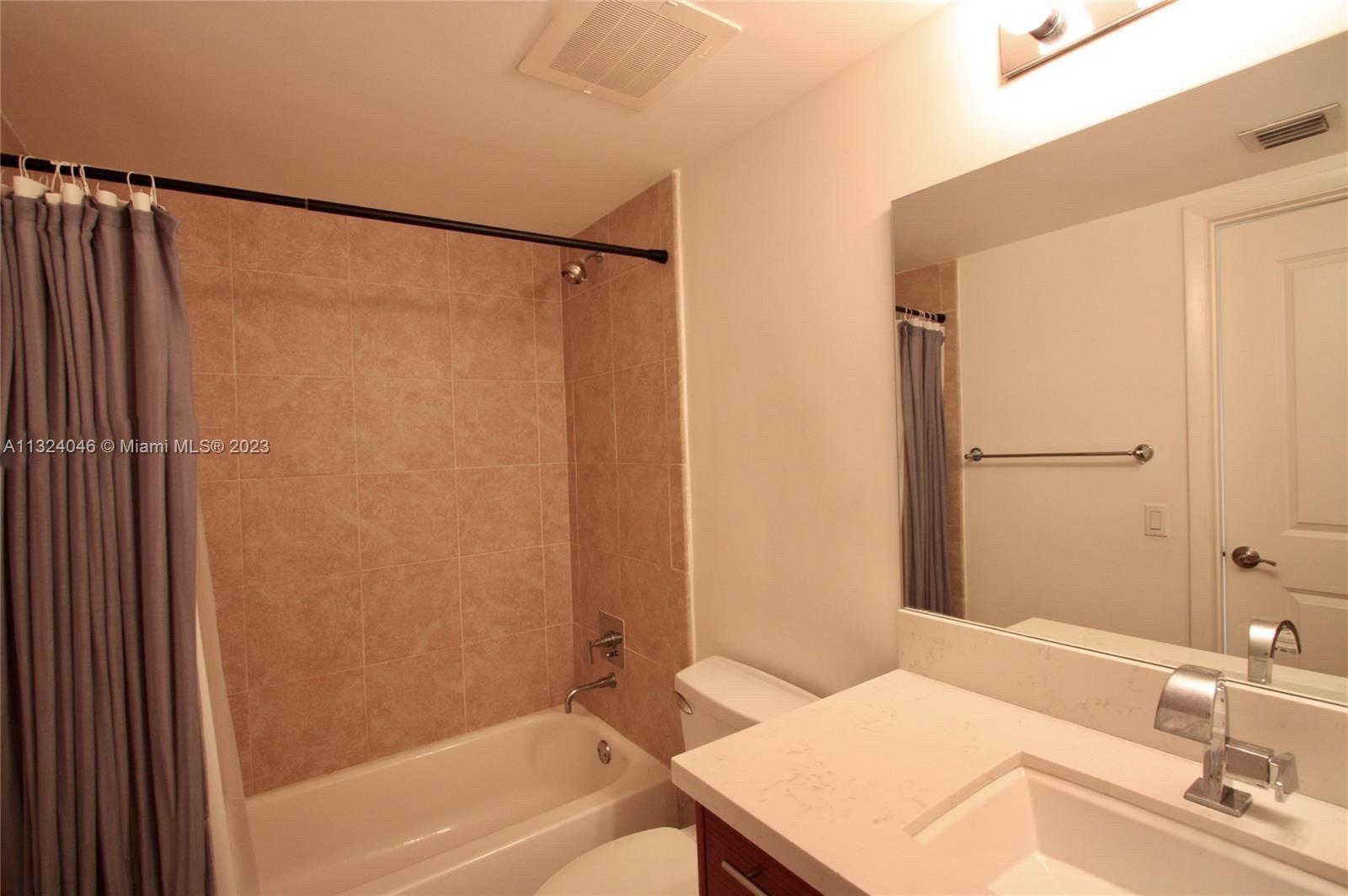2681 North Flamingo Road, Unit 506S Sunrise, FL 33323 - Photo 14 of 20 a bathroom with a sink and a mirror