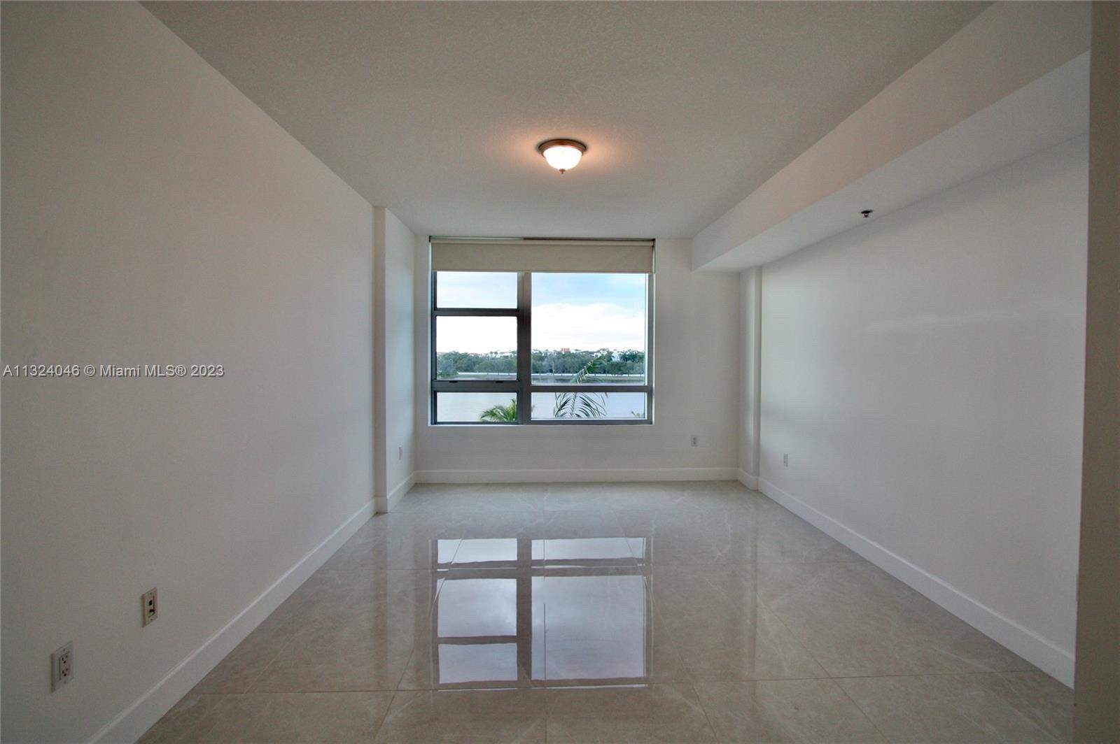 2681 North Flamingo Road, Unit 506S Sunrise, FL 33323 - Photo 6 of 20 a view of an empty room with a window