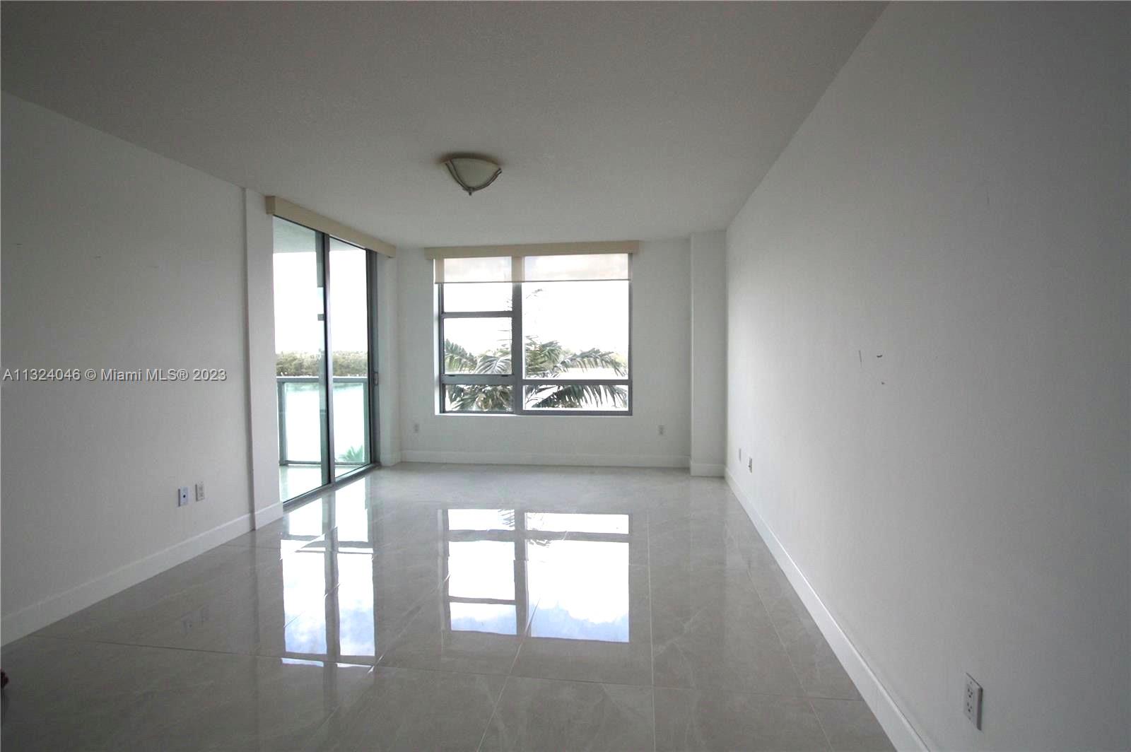 2681 North Flamingo Road, Unit 506S Sunrise, FL 33323 - Photo 7 of 20 an empty room with windows