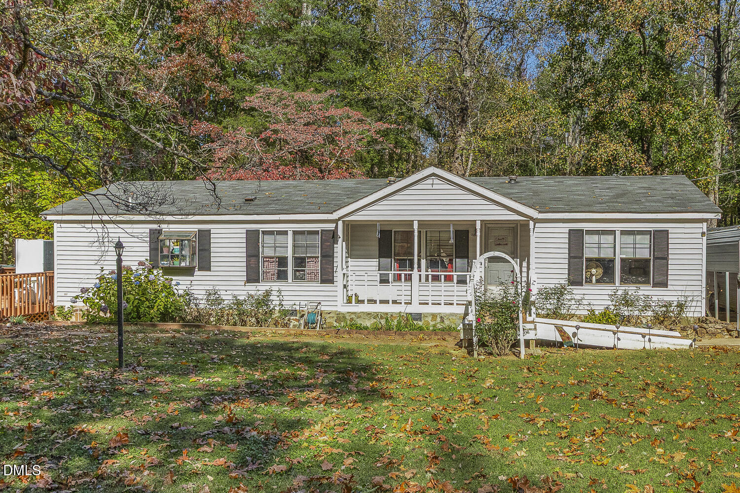 a front view of a house with yard patio and swimming pool