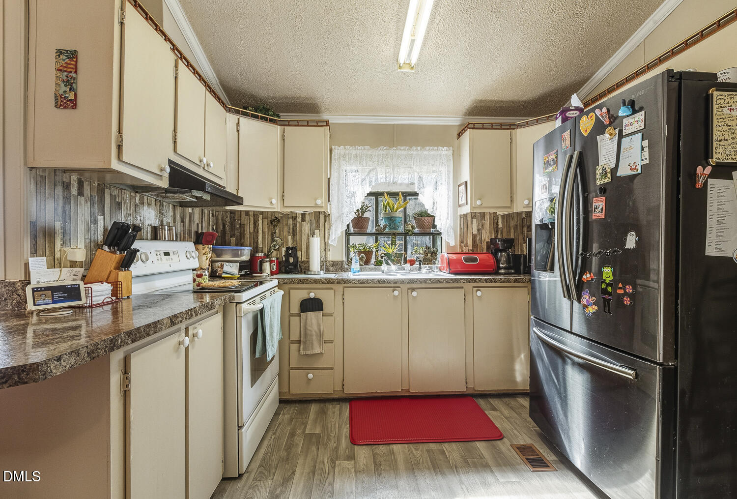 3663 Chewning Road Oxford, NC 27565 - Photo 19 of 43 a kitchen with refrigerator and sink