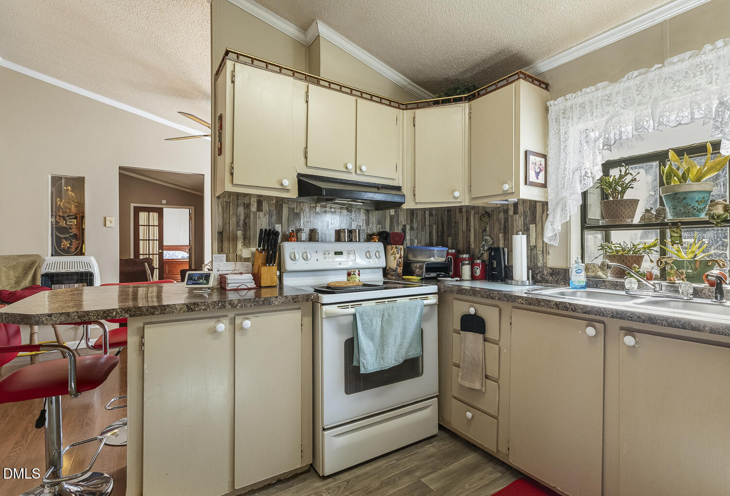 3663 Chewning Road Oxford, NC 27565 - Photo 20 of 43 a kitchen with stainless steel appliances granite countertop a sink and cabinets