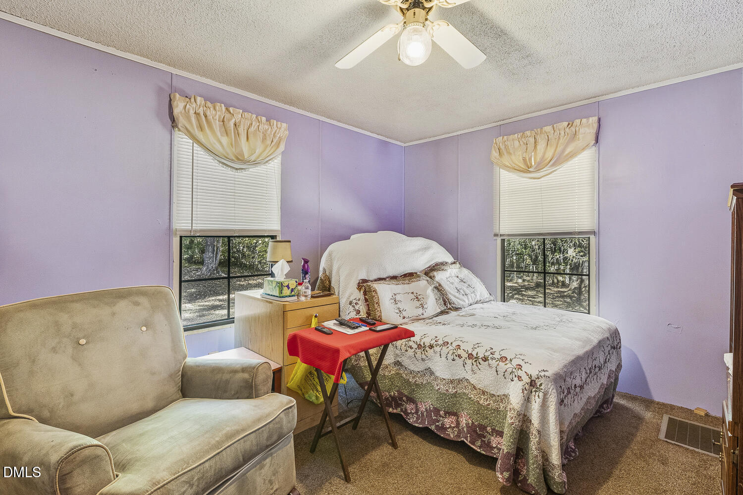 3663 Chewning Road Oxford, NC 27565 - Photo 25 of 43 a bedroom with a bed and chandelier