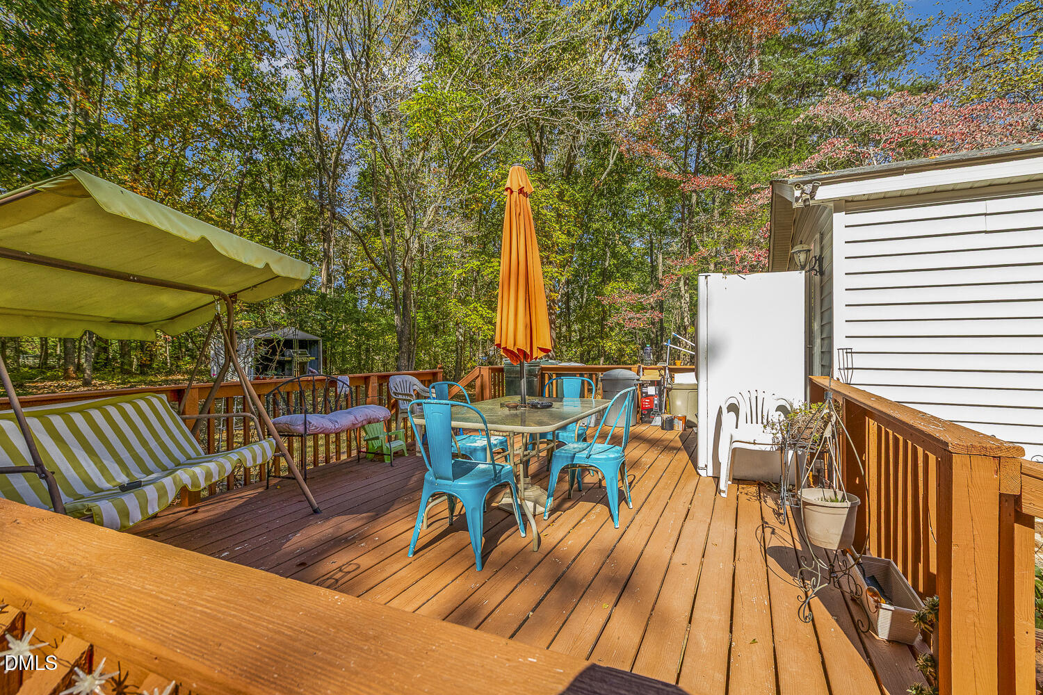 3663 Chewning Road Oxford, NC 27565 - Photo 29 of 43 a view of a patio with a table chairs and wooden floor