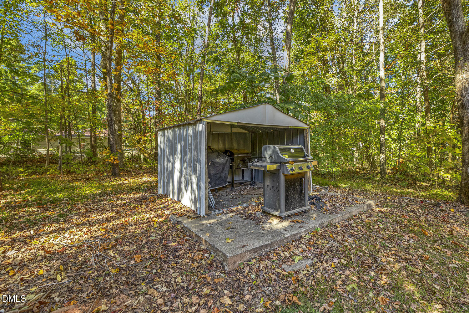 3663 Chewning Road Oxford, NC 27565 - Photo 31 of 43 a view of a patio with table and chairs under an umbrella