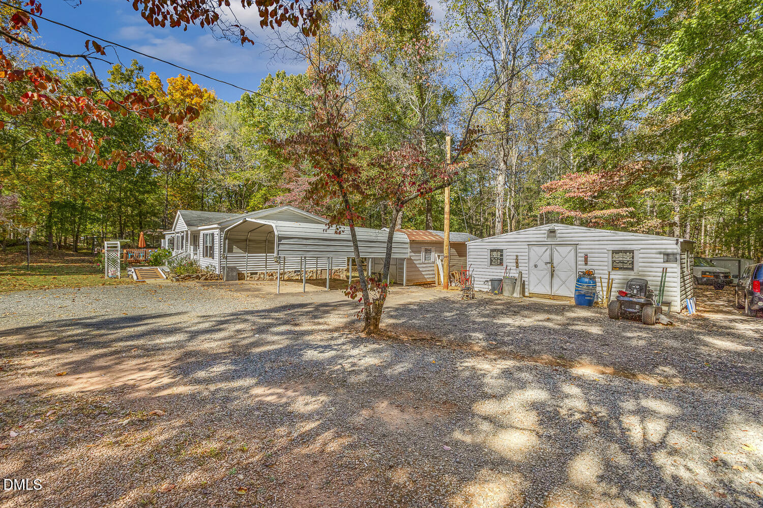 3663 Chewning Road Oxford, NC 27565 - Photo 33 of 43 a view of a white house with a big yard and large trees