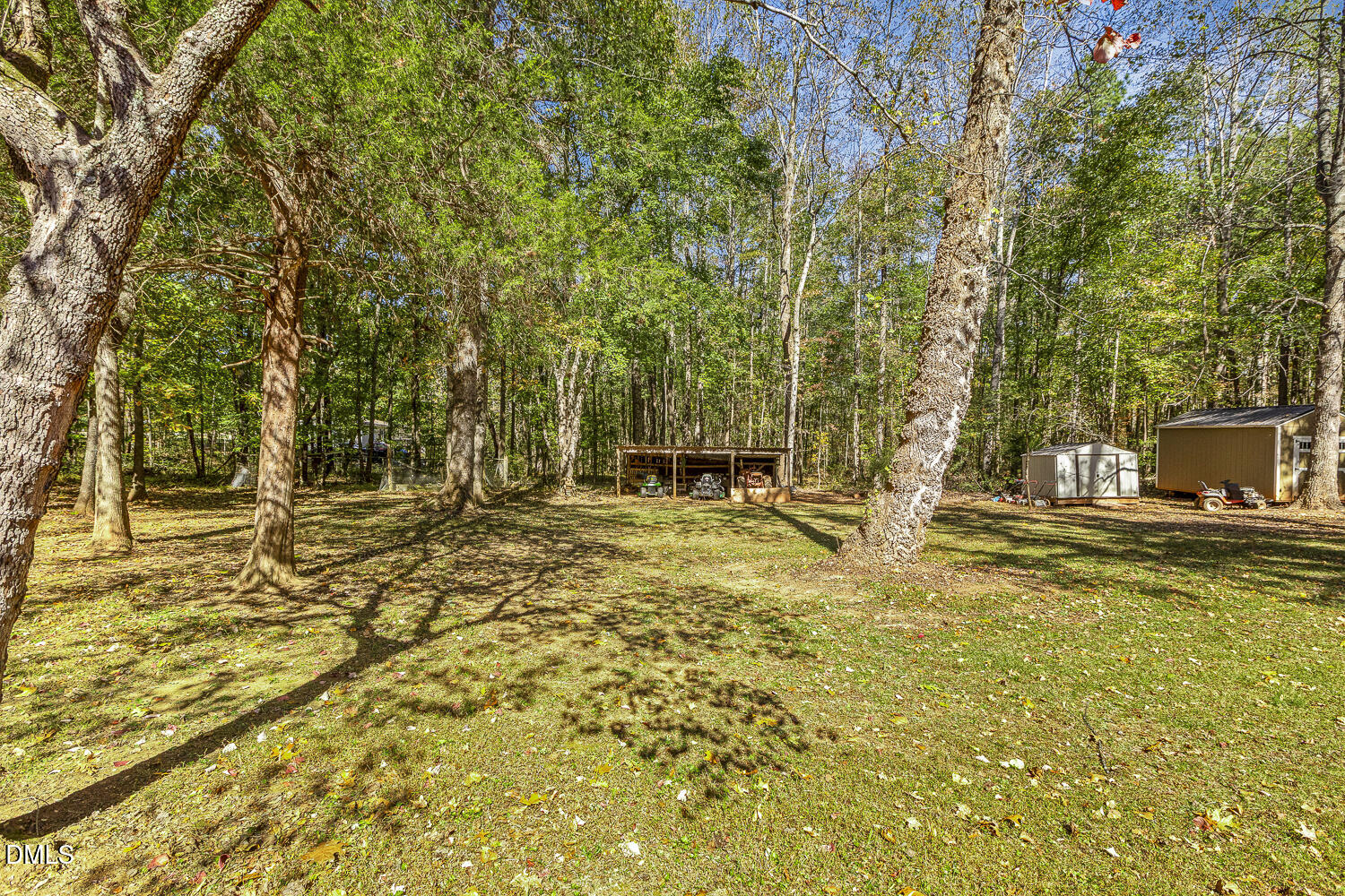 3663 Chewning Road Oxford, NC 27565 - Photo 36 of 43 a backyard of a house with large trees and a yard