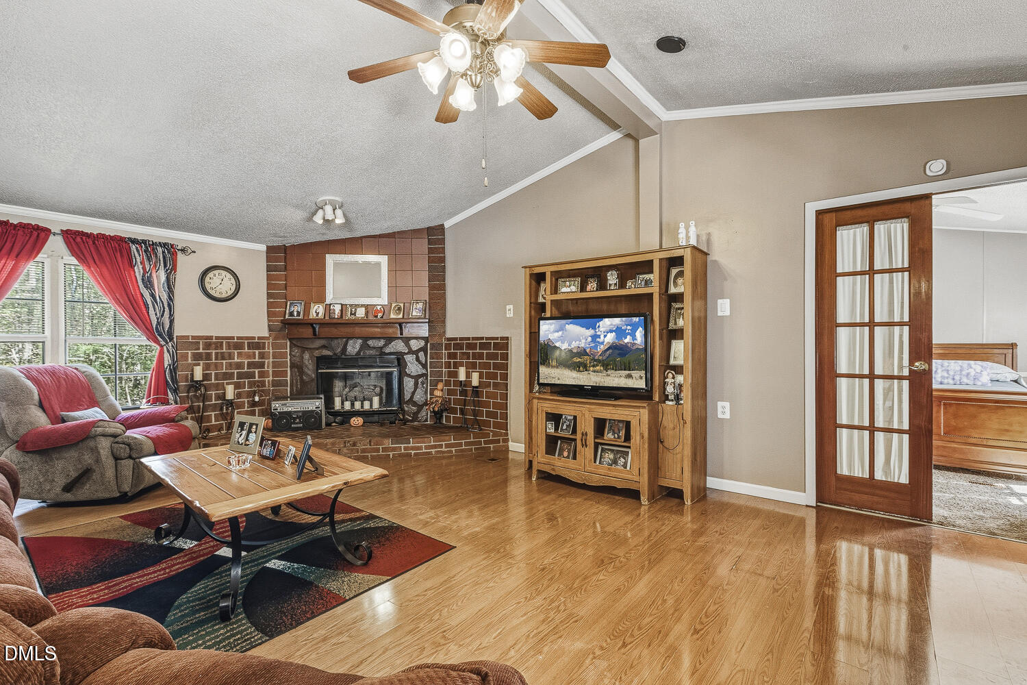 3663 Chewning Road Oxford, NC 27565 - Photo 5 of 43 a living room with fireplace furniture and a flat screen tv