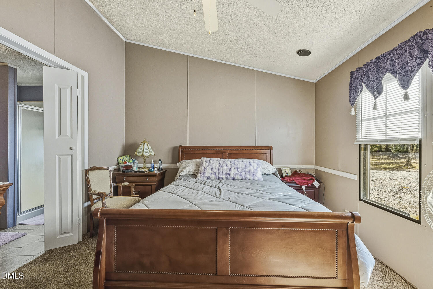 3663 Chewning Road Oxford, NC 27565 - Photo 8 of 43 a bed sitting in a bedroom next to a window