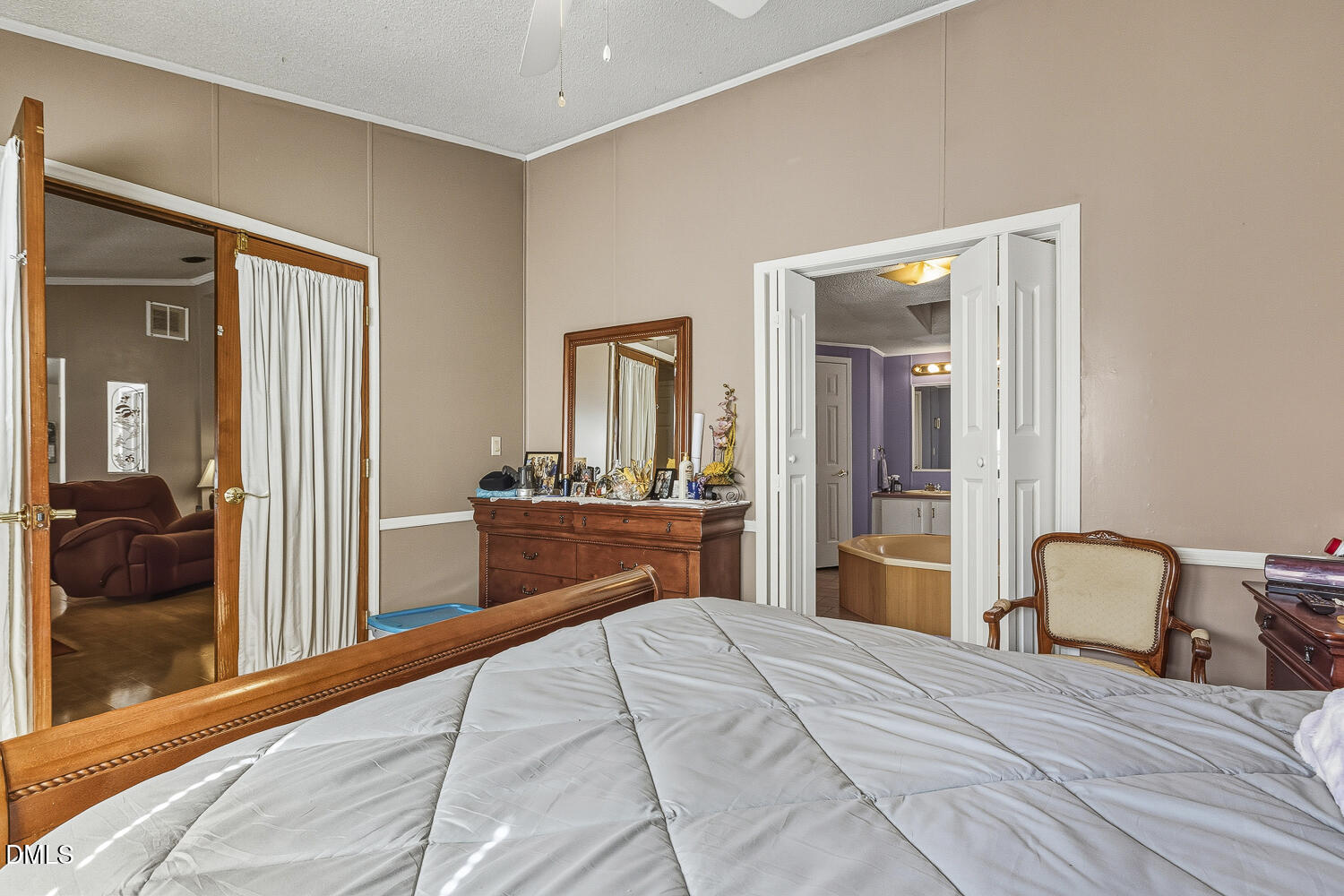 3663 Chewning Road Oxford, NC 27565 - Photo 9 of 43 a bedroom with a bed and a large mirror