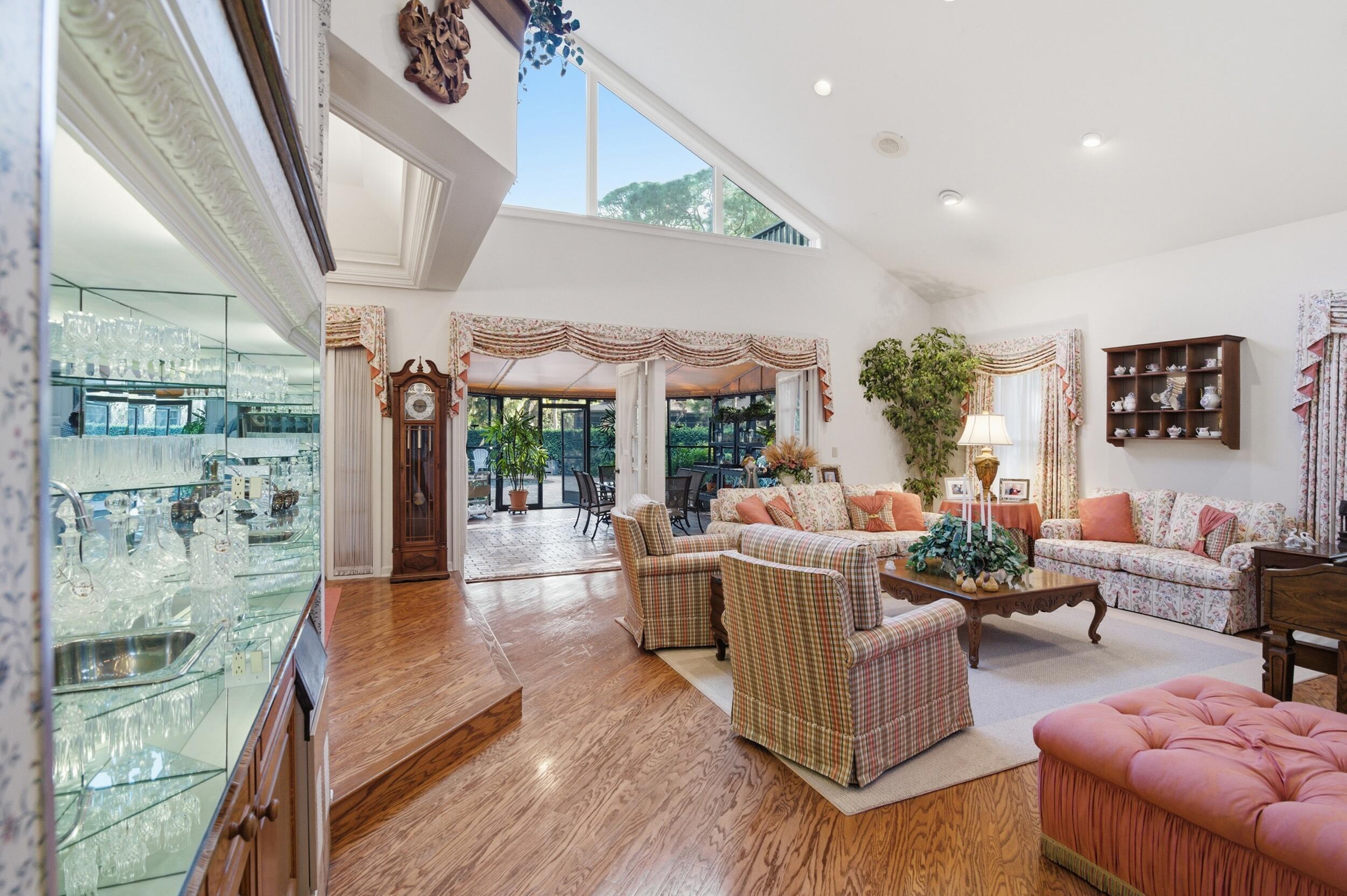 4838 Charlton Way Delray Beach, FL 33484 - Photo 14 of 74 a living room with fireplace furniture and a large window