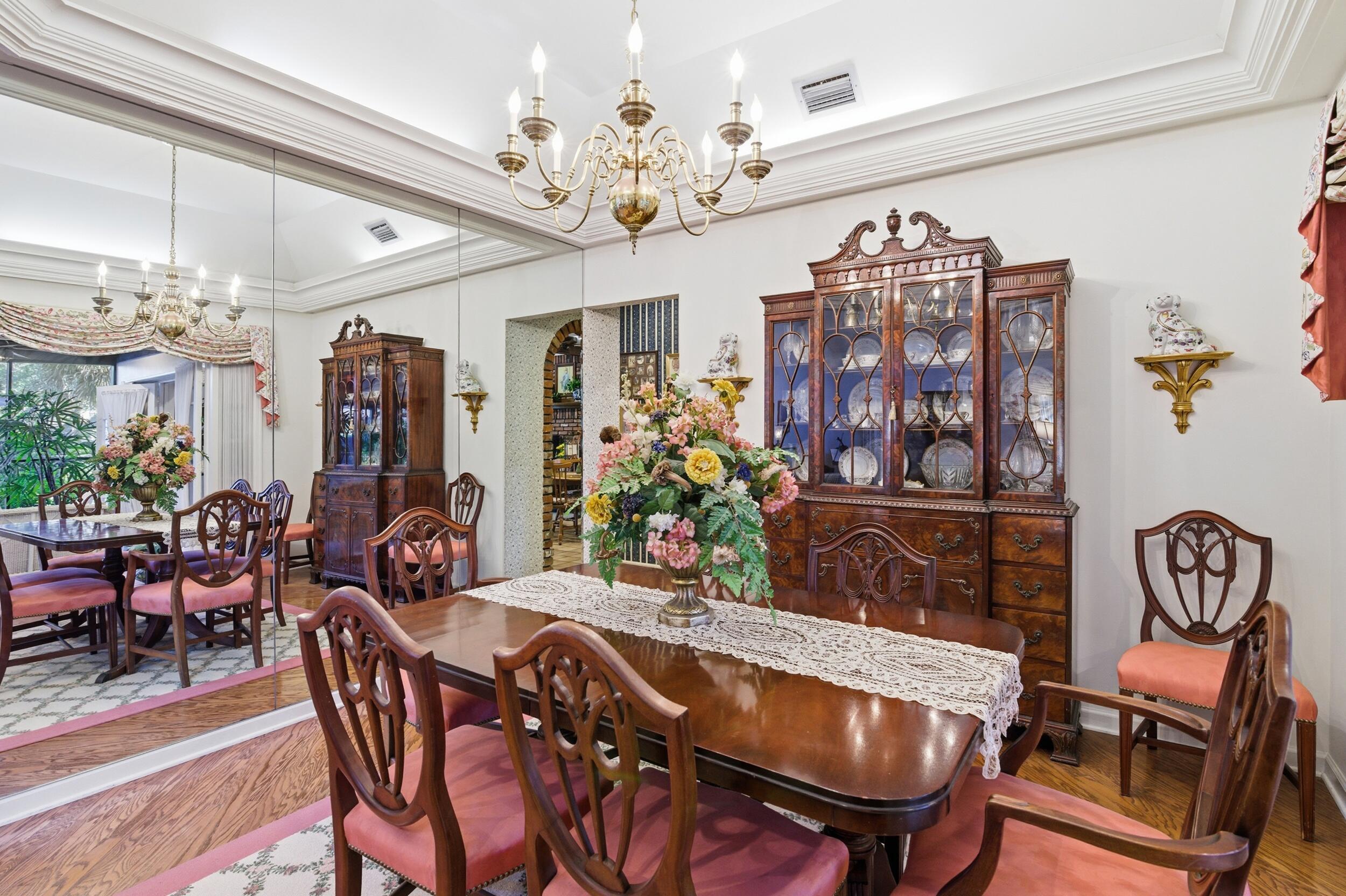 4838 Charlton Way Delray Beach, FL 33484 - Photo 19 of 74 a view of a dining room with furniture and chandelier