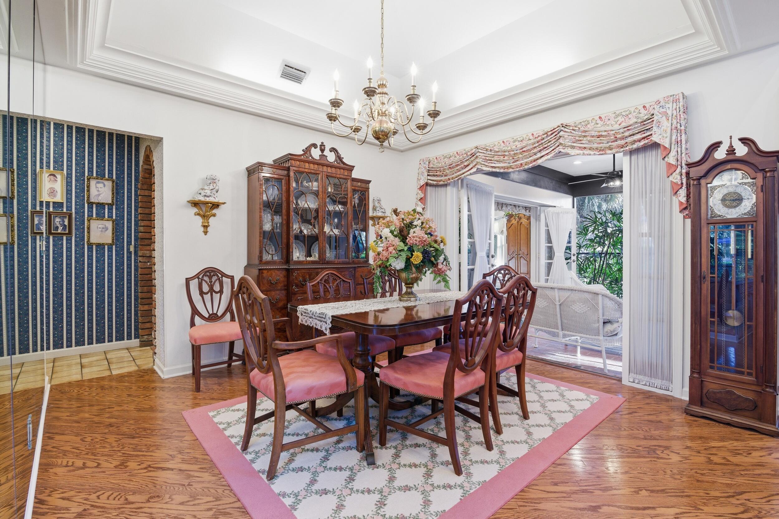 4838 Charlton Way Delray Beach, FL 33484 - Photo 20 of 74 a view of a dining room with furniture window and wooden floor