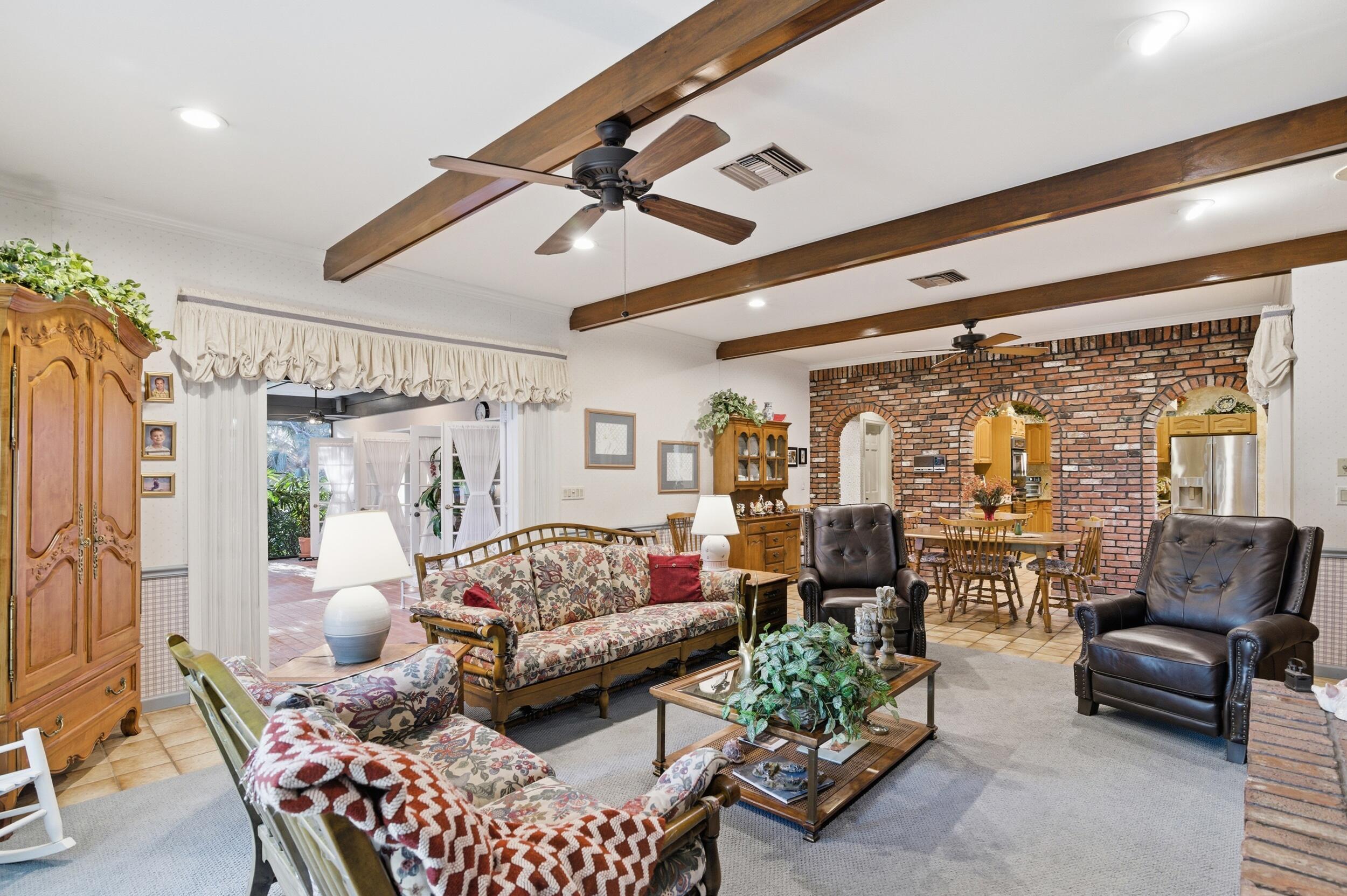 4838 Charlton Way Delray Beach, FL 33484 - Photo 26 of 74 a living room with furniture and a large window