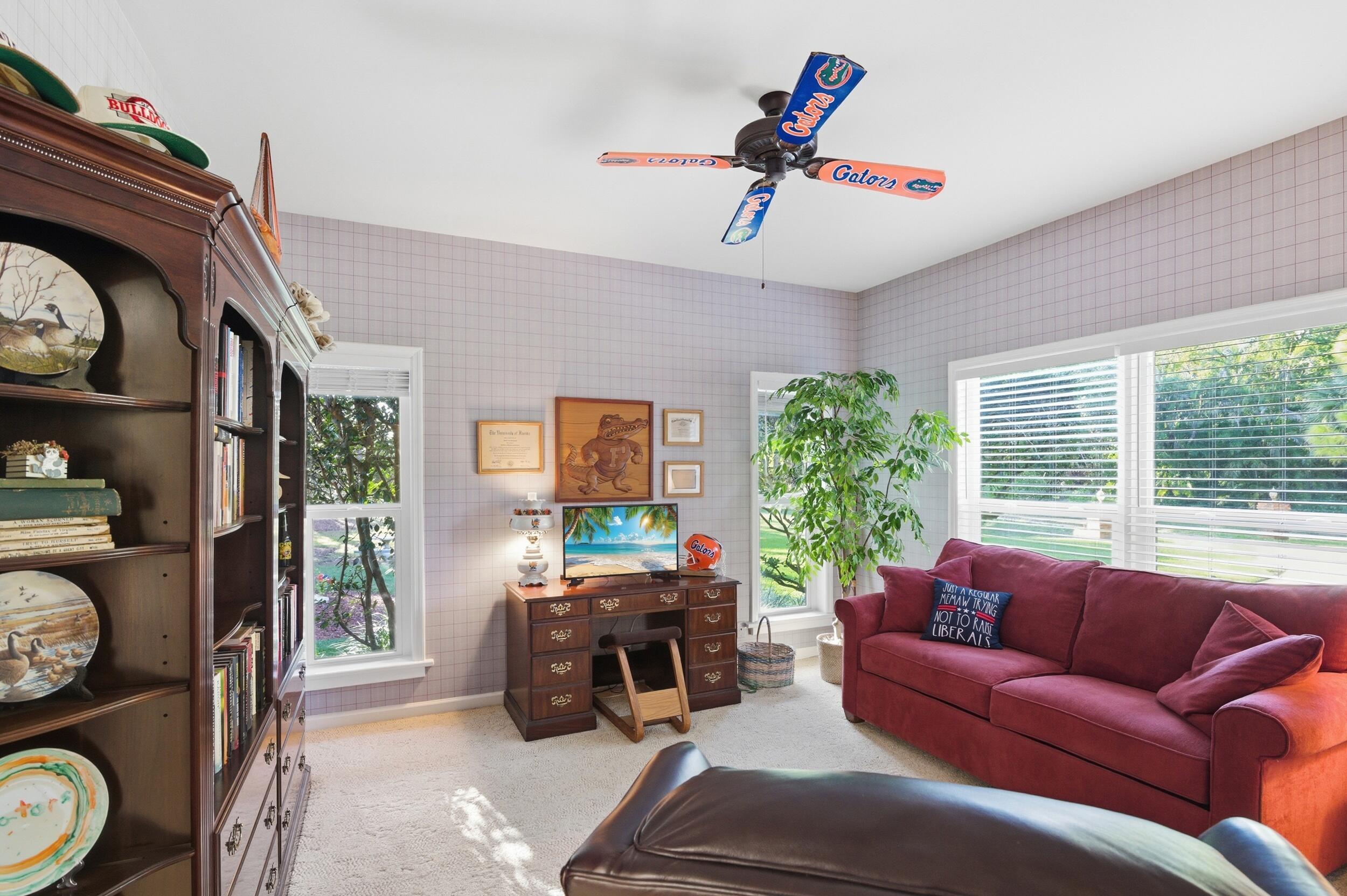 4838 Charlton Way Delray Beach, FL 33484 - Photo 32 of 74 a living room with furniture and a large window
