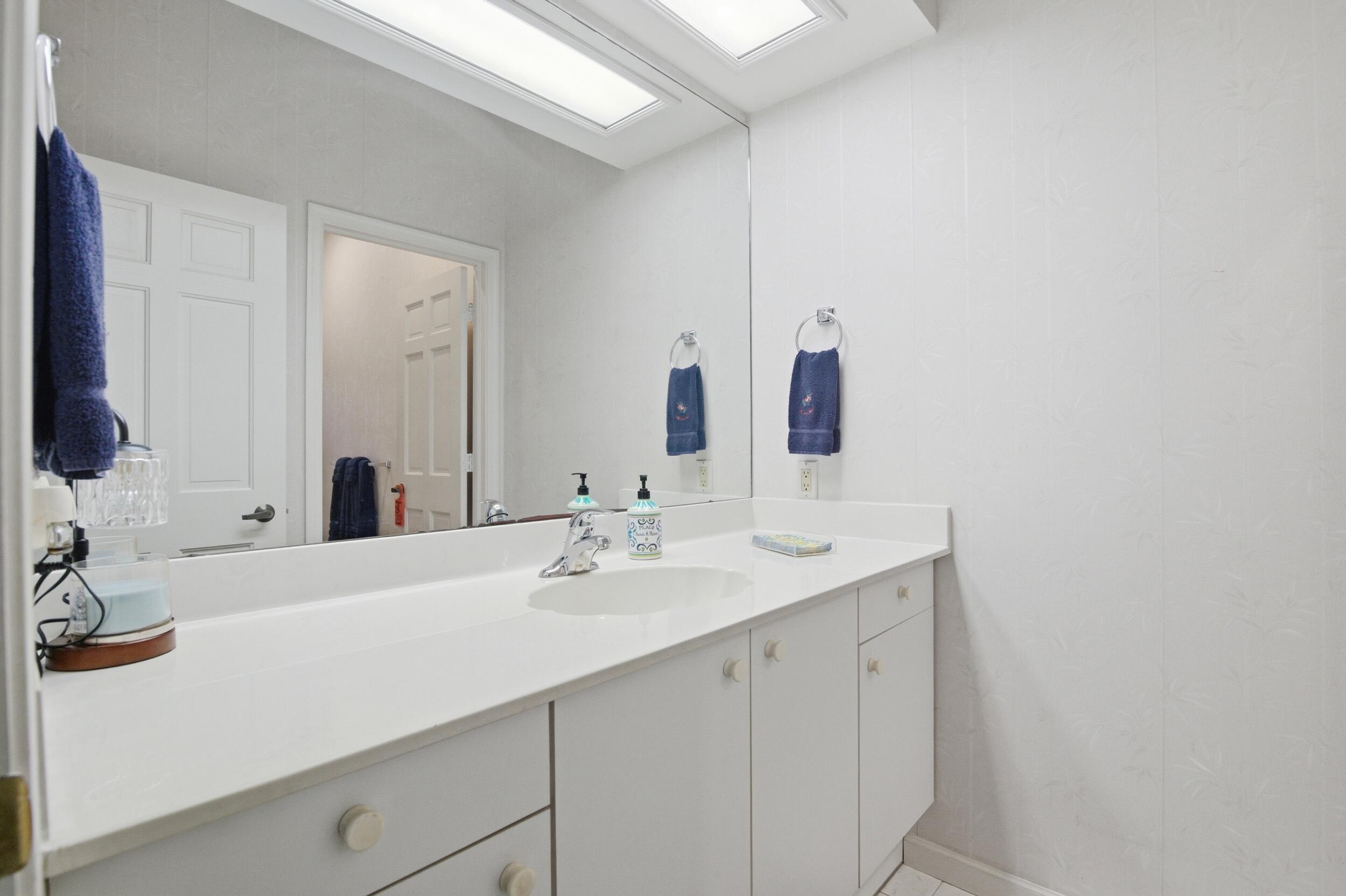 4838 Charlton Way Delray Beach, FL 33484 - Photo 37 of 74 a bathroom with a sink and a mirror