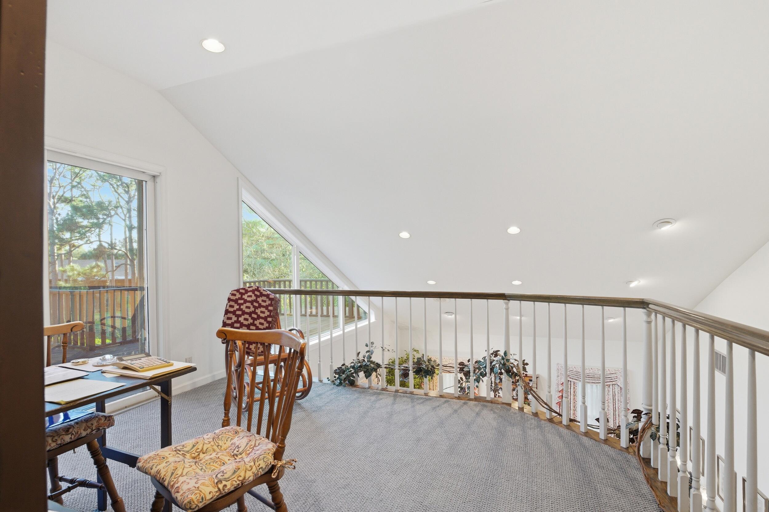 4838 Charlton Way Delray Beach, FL 33484 - Photo 40 of 74 a view of a hallway with furniture and a large window