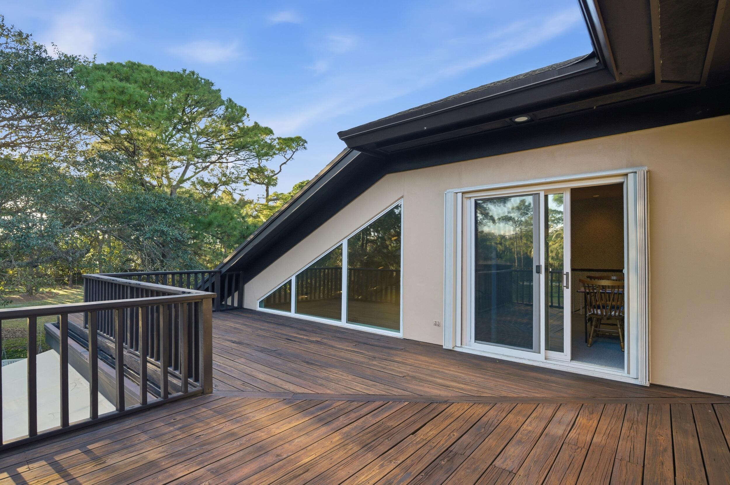 4838 Charlton Way Delray Beach, FL 33484 - Photo 43 of 74 a view of backyard with deck and wooden floor