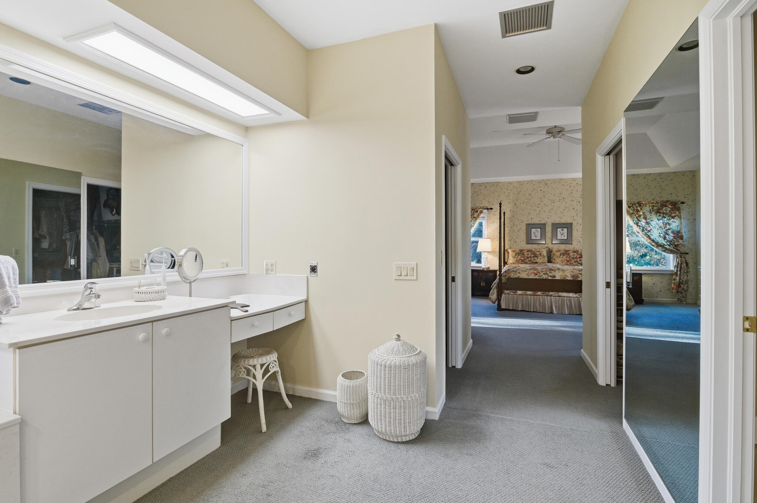 4838 Charlton Way Delray Beach, FL 33484 - Photo 49 of 74 a room with a sink and a large mirror