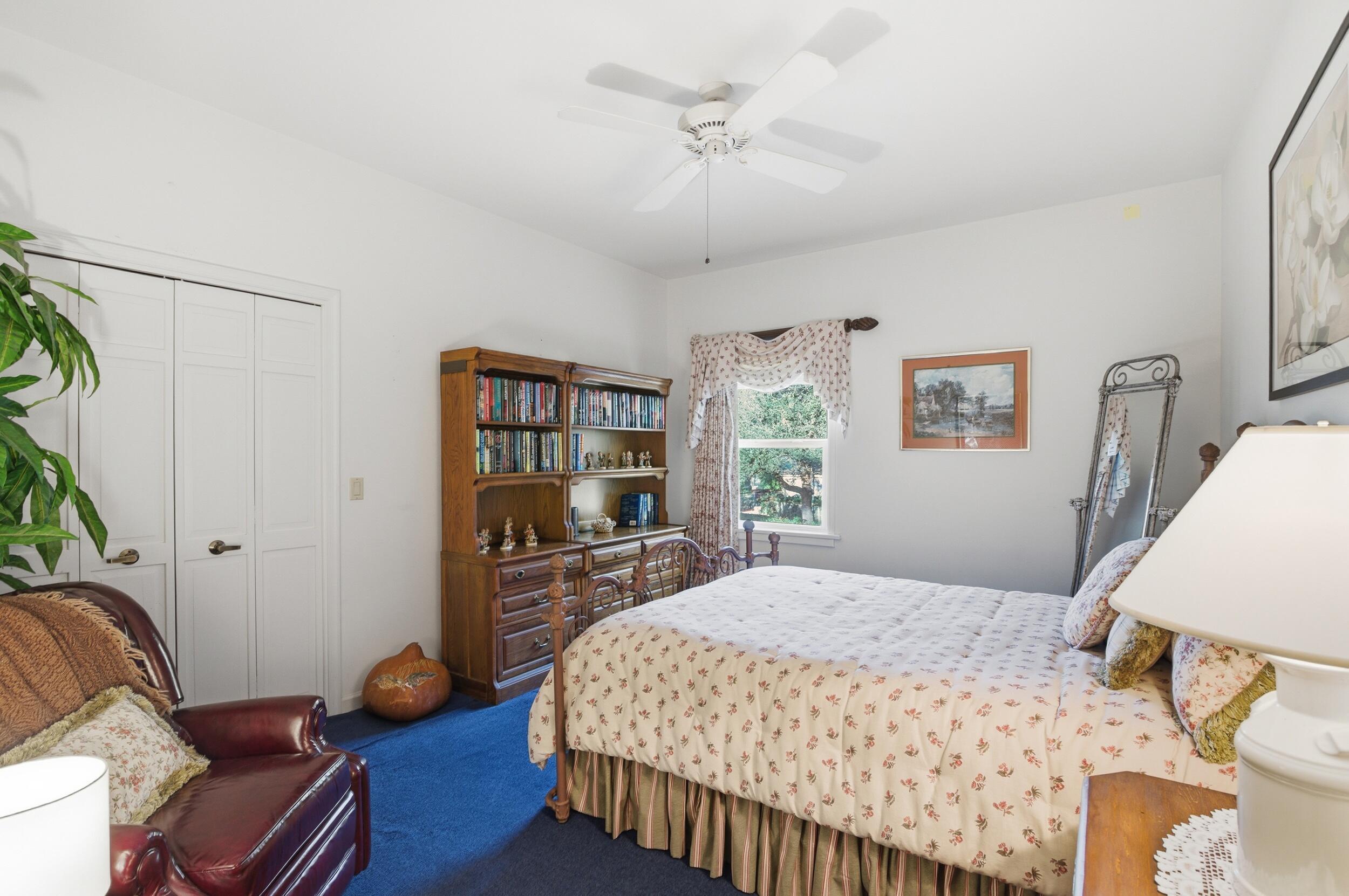 4838 Charlton Way Delray Beach, FL 33484 - Photo 50 of 74 a bedroom with a bed wooden floor and window