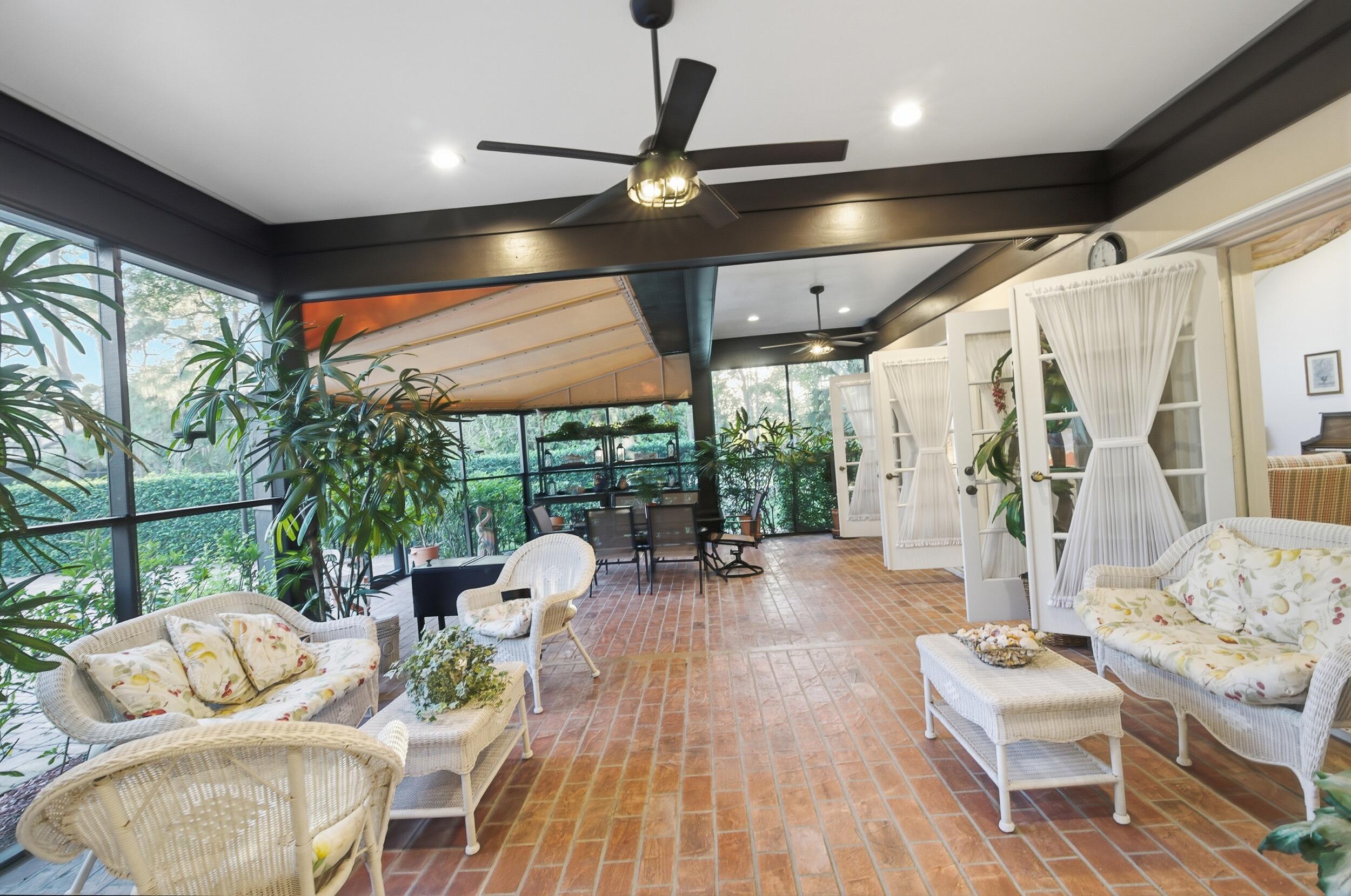 4838 Charlton Way Delray Beach, FL 33484 - Photo 56 of 74 a living room with furniture and a large window