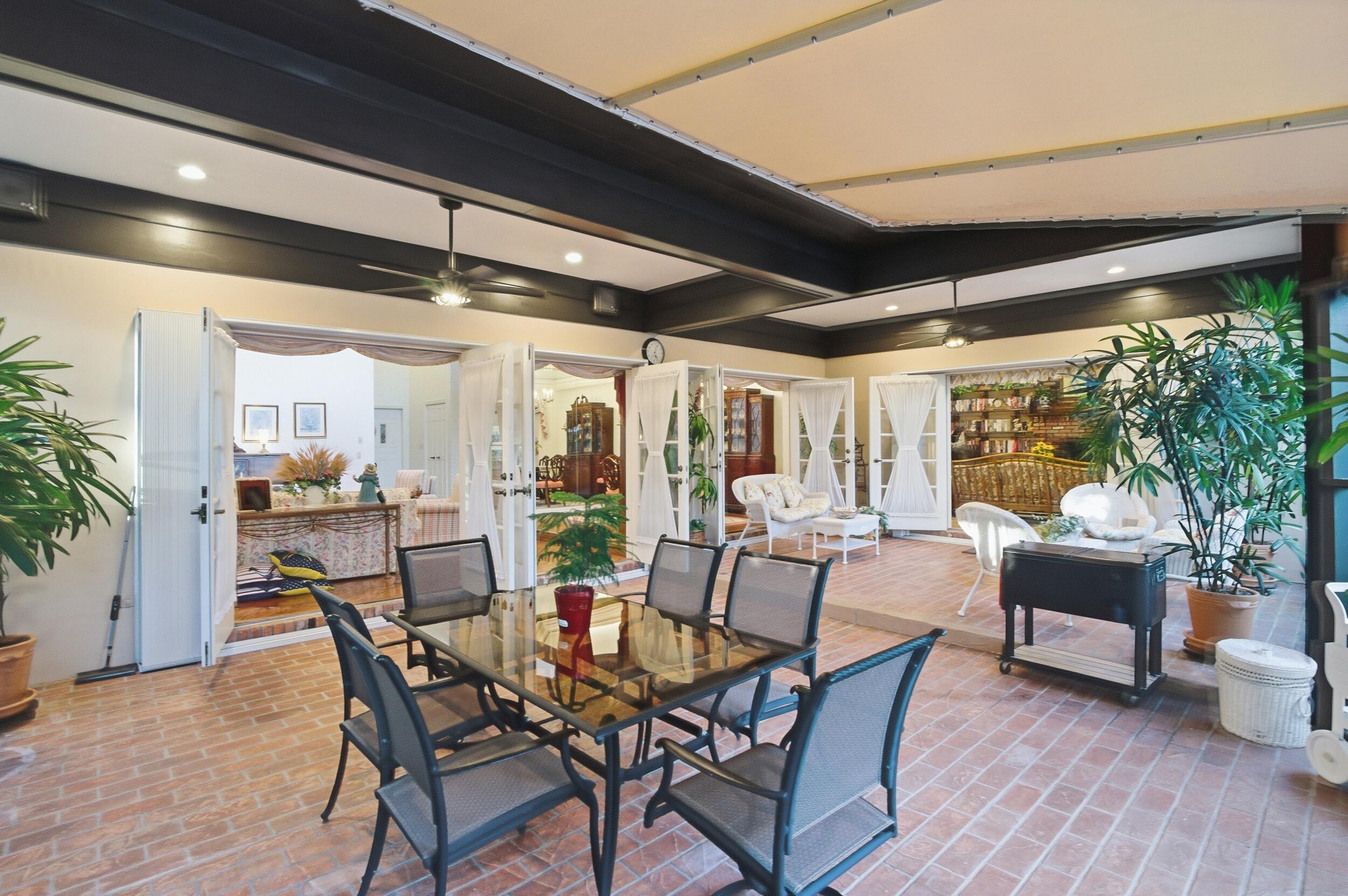 4838 Charlton Way Delray Beach, FL 33484 - Photo 59 of 74 a view of a dining room with furniture window and outside view