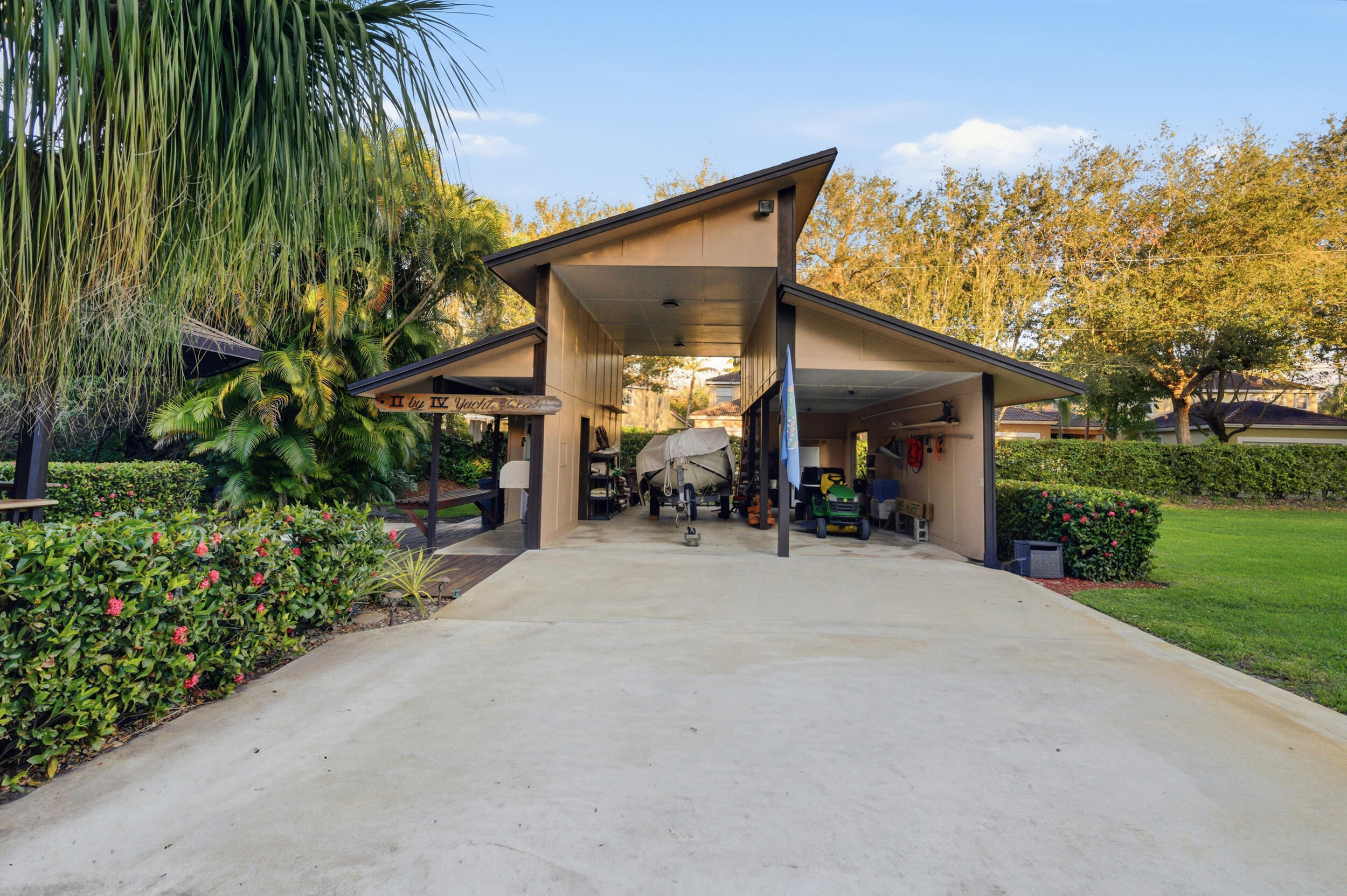 4838 Charlton Way Delray Beach, FL 33484 - Photo 68 of 74 a view of a house with porch and garden