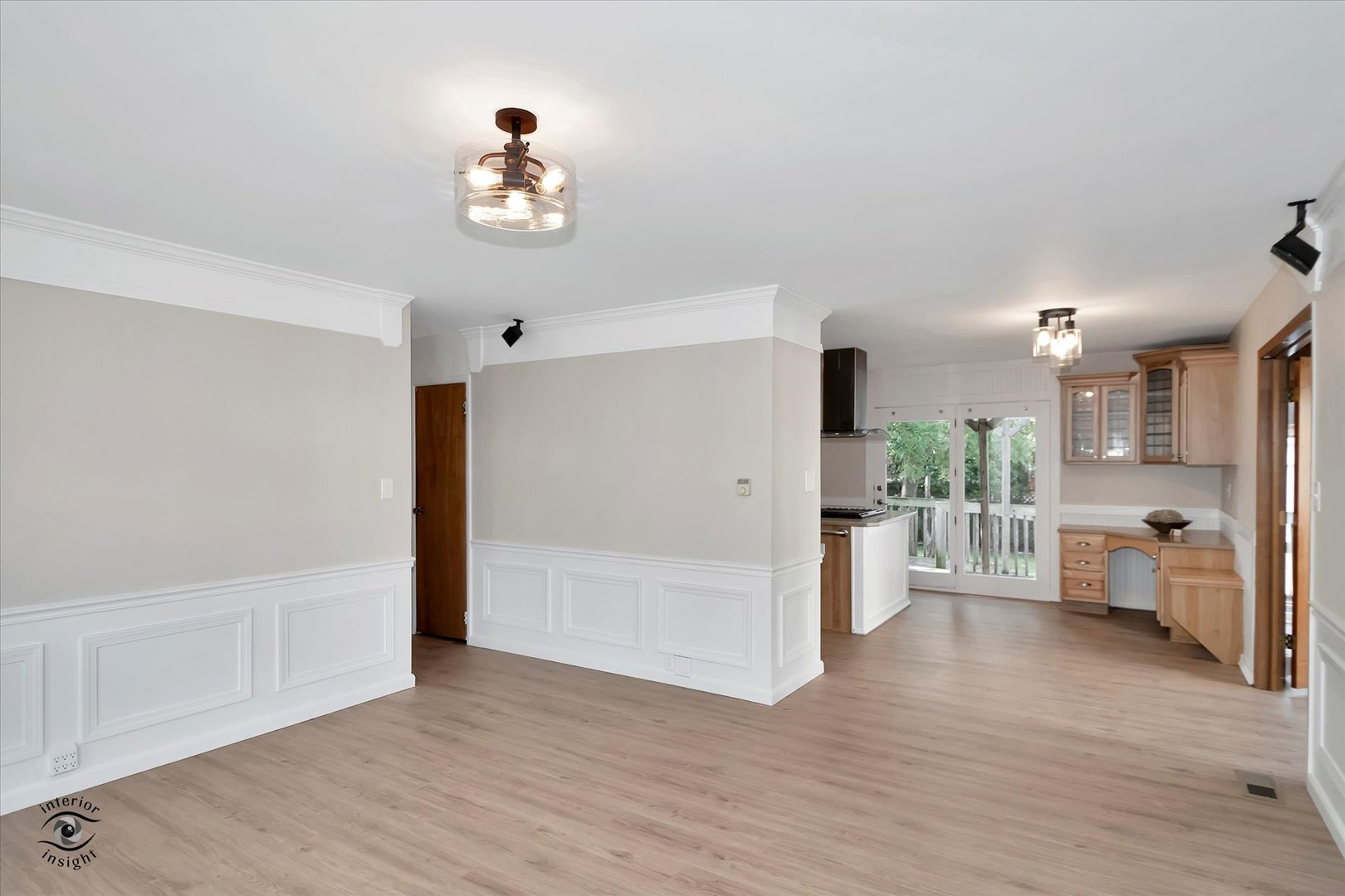 705 Union Avenue Romeoville, IL 60446 - Photo 3 of 26 a view of a livingroom with wooden floor a fireplace and windows