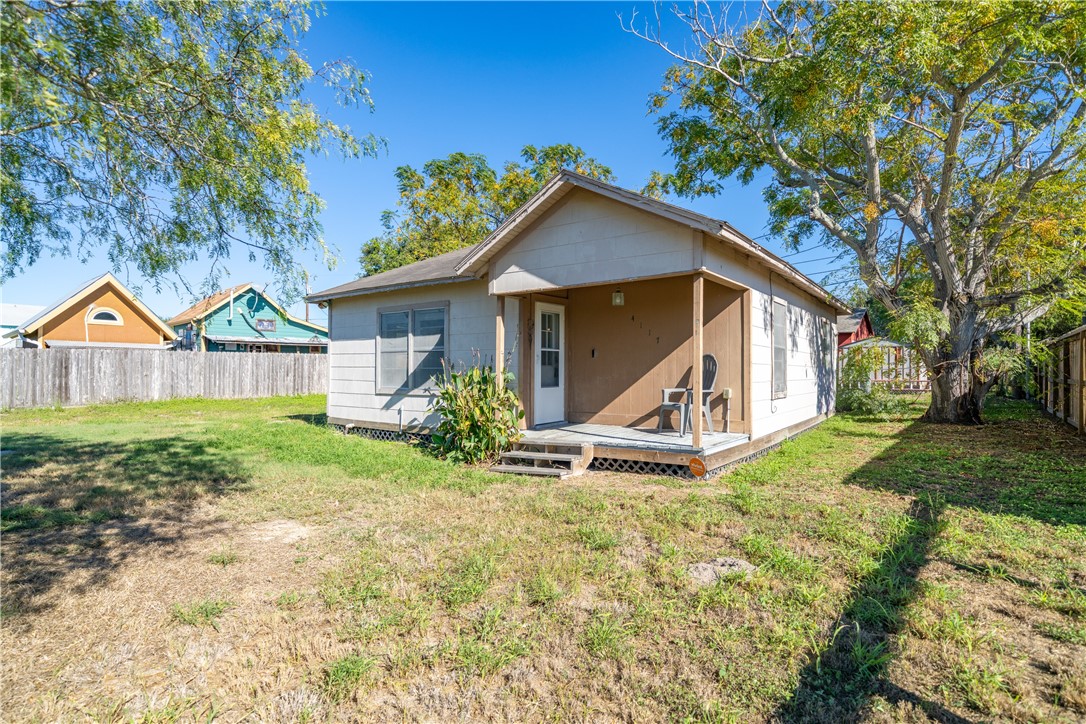 a view of a house with yard and green space