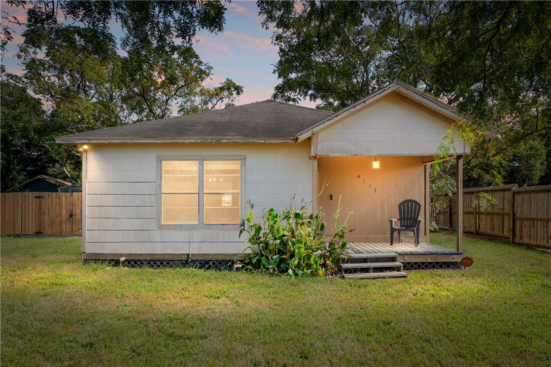 4117 Summit Drive Corpus Christi, TX 78418 - Photo 2 of 22 a backyard of a house with table and chairs