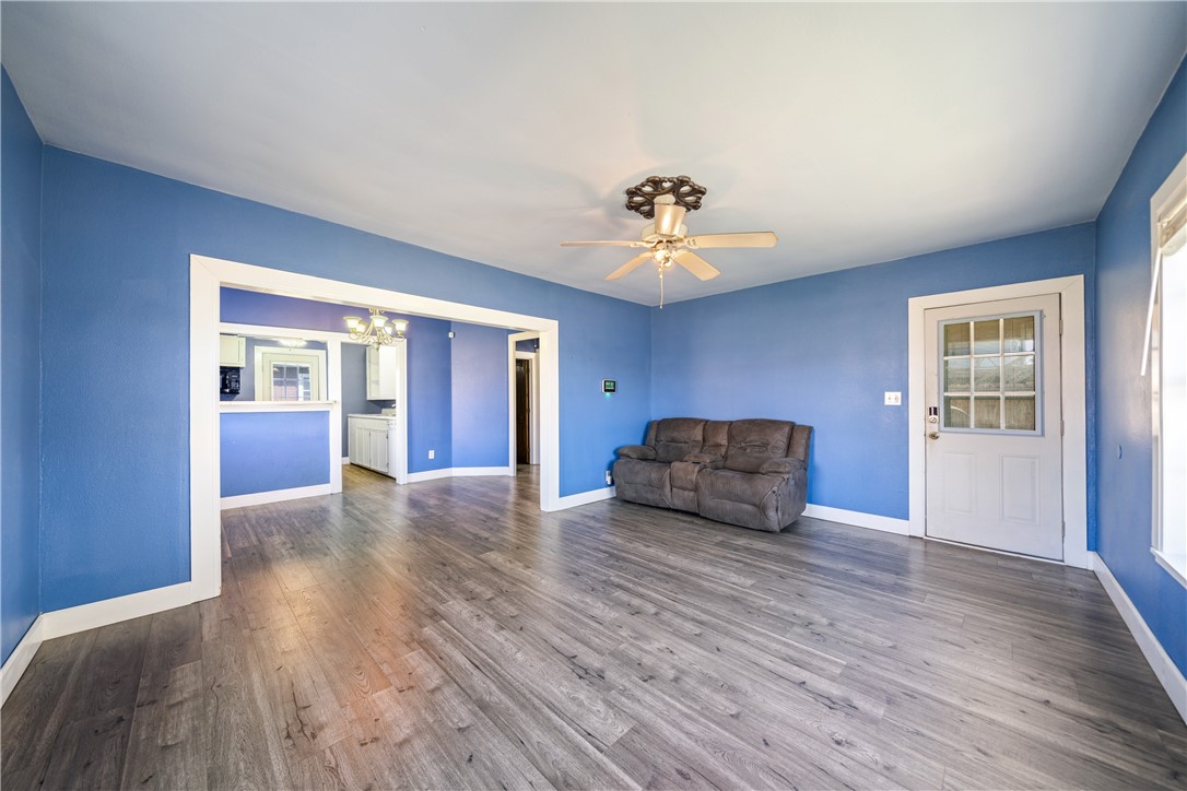 4117 Summit Drive Corpus Christi, TX 78418 - Photo 5 of 22 a view of an empty room with a window and wooden floor