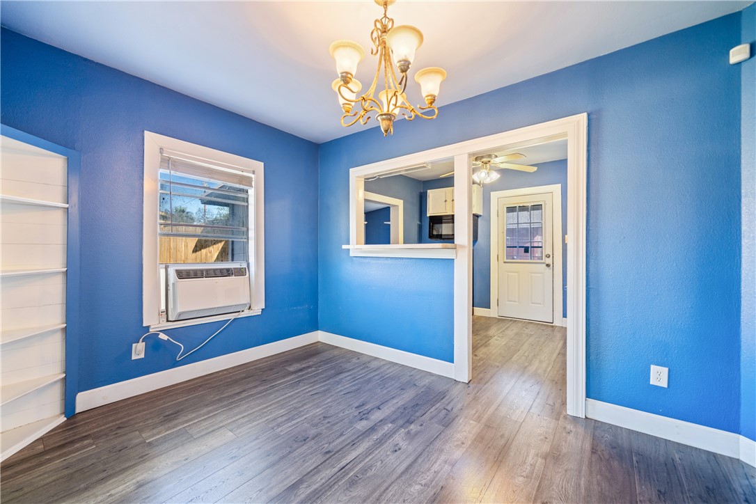 4117 Summit Drive Corpus Christi, TX 78418 - Photo 6 of 22 a view of an empty room with wooden floor and a window