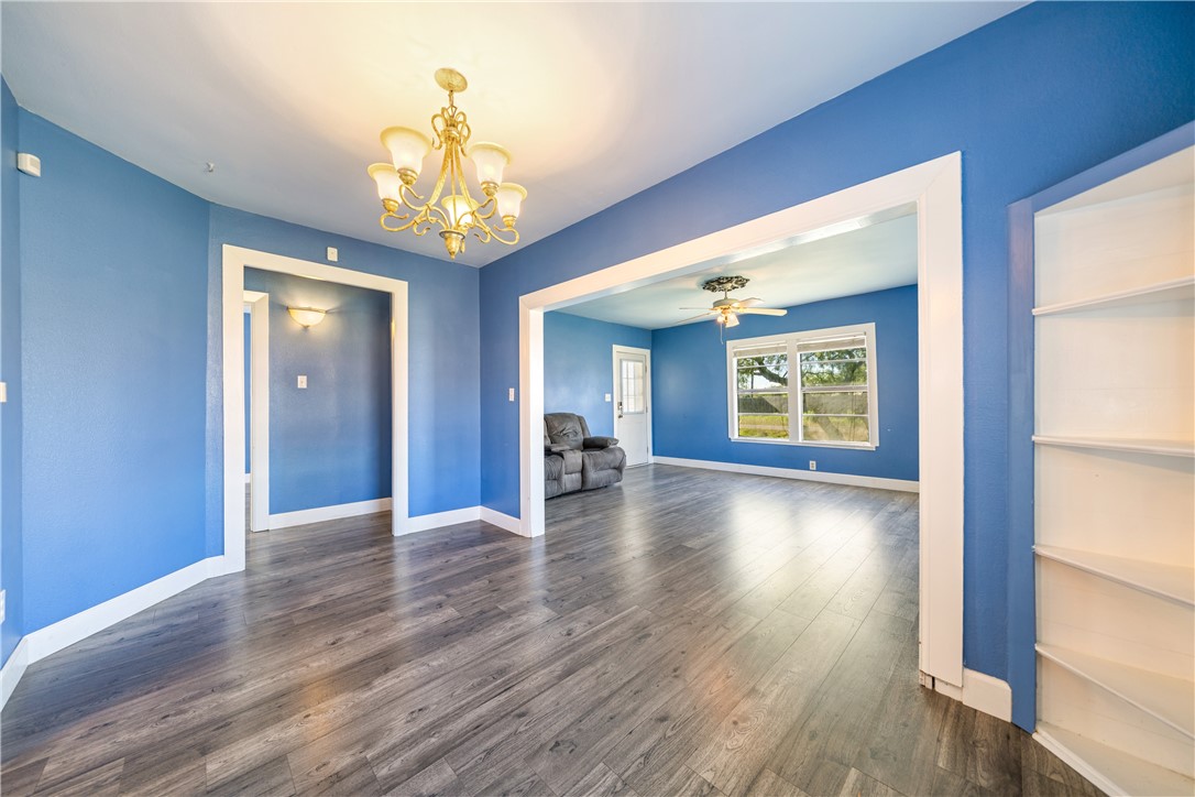 4117 Summit Drive Corpus Christi, TX 78418 - Photo 8 of 22 a view of an empty room with wooden floor and a window